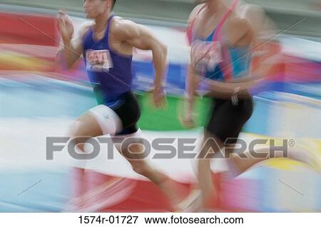 Side profile of two young men running View Large Photo Image Stock Photo - Side profile of two young men running. Fotosearch