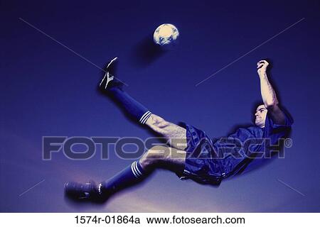 Soccer player kicking a ball View Large Photo Image Stock Image - Soccer player kicking a ball. Fotosearch