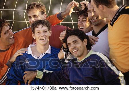 Stock Image - Soccer team together. Fotosearch