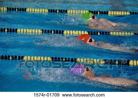 Stock Photo - Three male swimmers in a race. Fotosearch