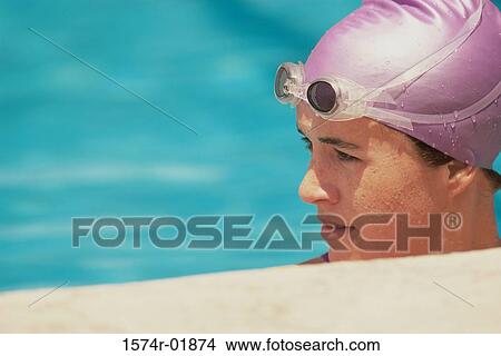 Young female swimmer in a swimming pool View Large Photo Image Picture - Young female swimmer in a swimming pool. Fotosearch