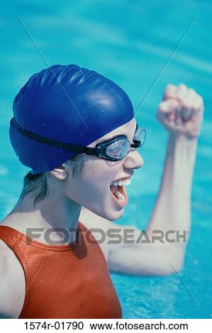 Young woman in a swimming pool View Large Photo Image Stock Image - Young woman in a swimming pool. Fotosearch