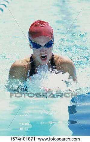 Young woman in a swimming pool View Large Photo Image Stock Image - Young woman in a swimming pool. Fotosearch