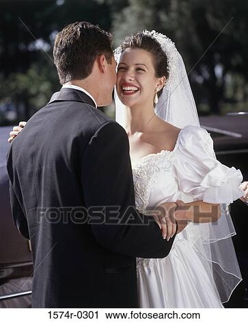 Stock Image - Bride and bridegroom at a wedding. Fotosearch