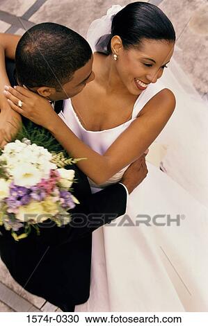 Bride and bridegroom dancing at their wedding View Large Photo Image Stock Image - Bride and bridegroom dancing at their wedding. Fotosearch