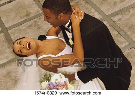 Bride and bridegroom dancing at their wedding View Large Photo Image Stock Photo - Bride and bridegroom dancing at their wedding. Fotosearch