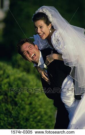 Bride hugging her groom View Large Photo Image Stock Photography - Bride hugging her groom. Fotosearch