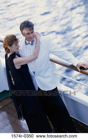 Couple holding each other on a ship View Large Photo Image Stock Image - Couple holding each other on a ship. Fotosearch