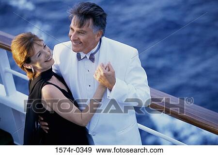 Couple holding each other on a ship View Large Photo Image Stock Photo - Couple holding each other on a ship. Fotosearch