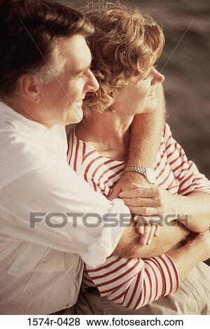 Stock Photo - Couple holding each other. Fotosearch