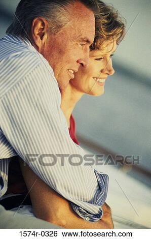 Couple holding each other View Large Photo Image Stock Photograph - Couple holding each other. Fotosearch