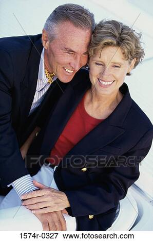 Stock Photo - Couple sitting together. Fotosearch