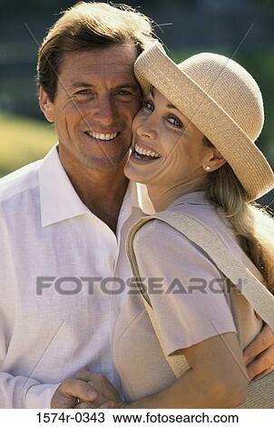 Portrait of a couple standing face to face smiling View Large Photo Image Stock Image - Portrait of a couple standing face to face smiling. Fotosearch