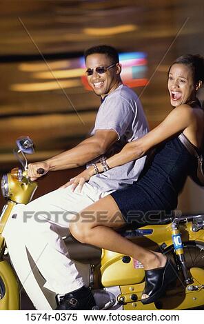 Portrait of a young couple on a motorcycle View Large Photo Image Stock Photography - Portrait of a young couple on a motorcycle. Fotosearch