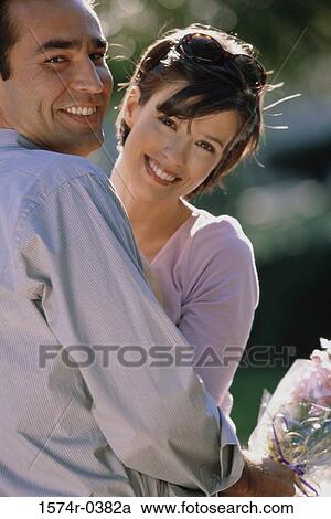 Portrait of a young couple smiling View Large Photo Image Stock Image - Portrait of a young couple smiling. Fotosearch