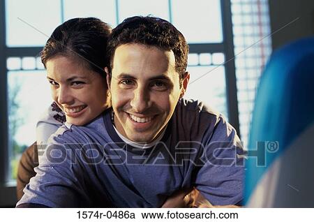 Portrait of a young couple smiling View Large Photo Image Stock Image - Portrait of a young couple smiling. Fotosearch