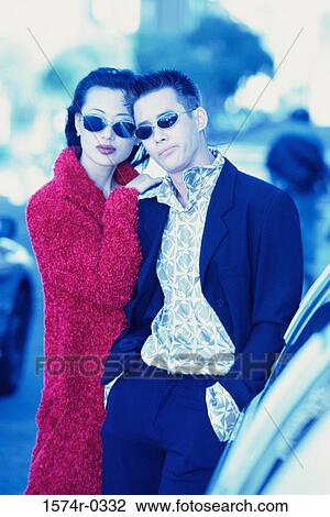 Portrait of a young couple standing together View Large Photo Image Stock Image - Portrait of a young couple standing together. Fotosearch
