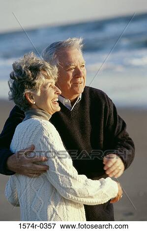 Senior couple holding each other at the beach View Large Photo Image Stock Photo - Senior couple holding each other at the beach. Fotosearch