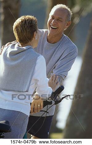 Stock Image - Senior couple laughing together. Fotosearch
