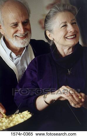 Senior couple standing together smiling View Large Photo Image Stock Photography - Senior couple standing together smiling. Fotosearch