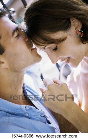 Stock Photograph - Young couple holding each other. Fotosearch