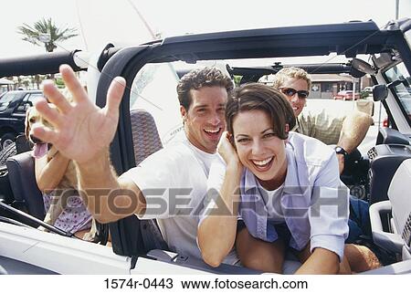 Young couple in a car View Large Photo Image Stock Image - Young couple in a car. Fotosearch