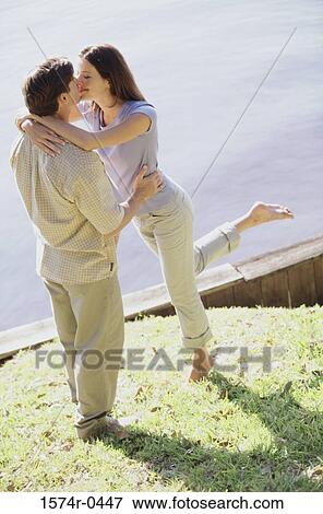 Young couple kissing View Large Photo Image Stock Photo - Young couple kissing. Fotosearch