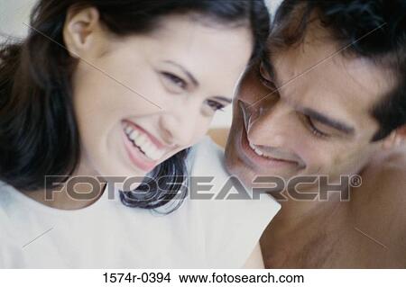 Picture - Young couple laughing. Fotosearch