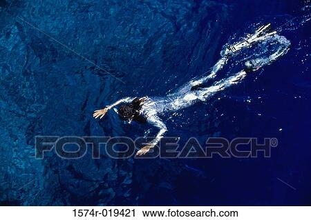 Woman swimming in the sea View Large Photo Image Stock Image - Woman swimming in the sea. Fotosearch