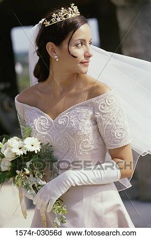 Bride holding a bouquet of flowers View Large Photo Image Stock Image - Bride holding a bouquet of flowers. Fotosearch