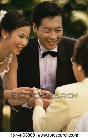 Bride offering tea to her mother View Large Photo Image Stock Photo - Bride offering tea to her mother. Fotosearch