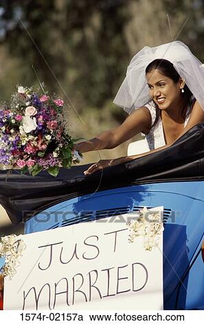 Bride preparing to toss a bouquet of flowers from a convertible car View Large Photo Image Stock Image - Bride preparing to toss a bouquet of flowers from a convertible car. Fotosearch