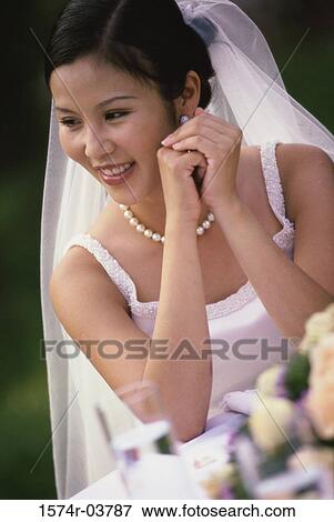 Close-up of a bride smiling View Large Photo Image Stock Photo - Close-up of a bride smiling. Fotosearch
