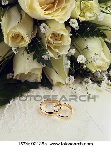 Close-up of wedding rings with a bouquet of flowers View Large Photo Image Stock Image - Close-up of wedding rings with a bouquet of flowers. Fotosearch
