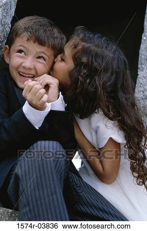 Stock Photograph - Girl kissing a boy. Fotosearch