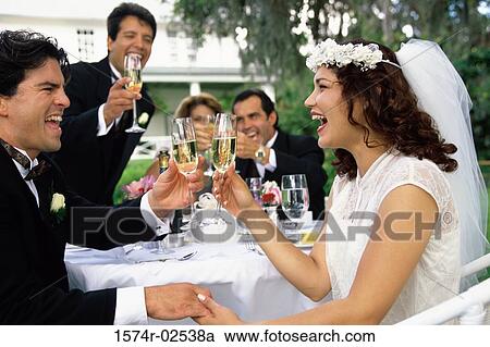 Newlywed couple and their friends toasting with champagne glasses View Large Photo Image Stock Image - Newlywed couple and their friends toasting with champagne glasses. Fotosearch