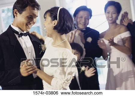 Newlywed couple dancing at their wedding reception View Large Photo Image Stock Photograph - Newlywed couple dancing at their wedding reception. Fotosearch