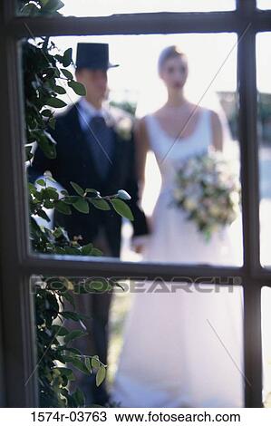 Newlywed couple standing together View Large Photo Image Stock Image - Newlywed couple standing together. Fotosearch