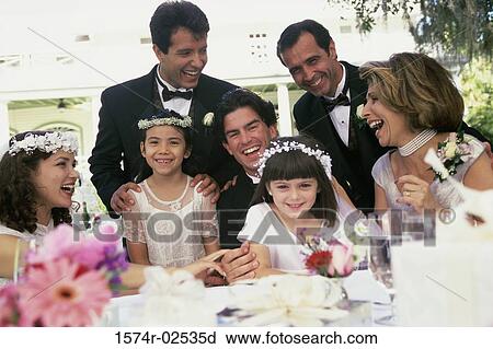 Newlywed couple with bridesmaids and groomsmen View Large Photo Image Stock Image - Newlywed couple with bridesmaids and groomsmen. Fotosearch
