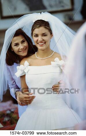 Newlywed young woman with her mother View Large Photo Image Stock Photo - Newlywed young woman with her mother. Fotosearch