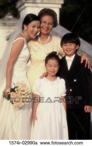 Stock Image - Portrait of a bride smiling with her mother. Fotosearch