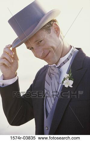 Portrait of a groom wearing a hat smiling View Large Photo Image Stock Photography - Portrait of a groom wearing a hat smiling. Fotosearch