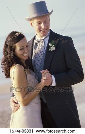 Young couple dancing on the beach View Large Photo Image Stock Image - Young couple dancing on the beach. Fotosearch