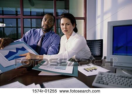 Businessman and businesswoman giving a presentation View Large Photo Image Stock Photography - Businessman and businesswoman giving a presentation. Fotosearch