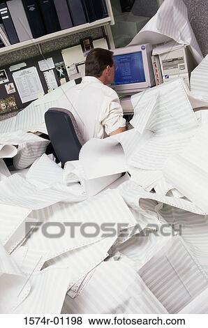 Businessman working in front of a computer monitor View Large Photo Image Stock Photo - Businessman working in front of a computer monitor. Fotosearch
