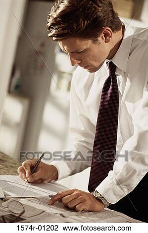 Businessman writing on paper View Large Photo Image Stock Image - Businessman writing on paper. Fotosearch