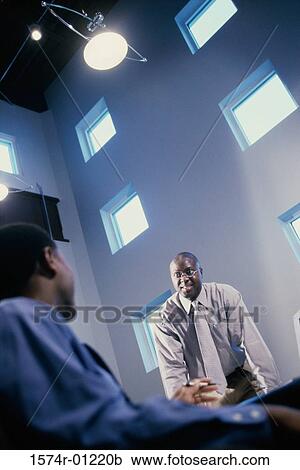 Businessmen discussing in a meeting View Large Photo Image Stock Image - Businessmen discussing in a meeting. Fotosearch