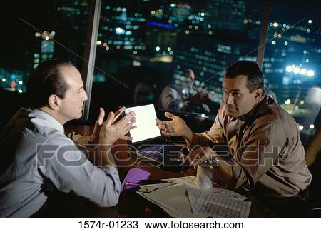 Businessmen sitting together discussing View Large Photo Image Stock Image - Businessmen sitting together discussing. Fotosearch