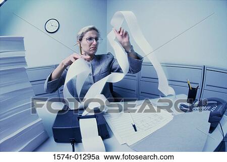 Businesswoman working in an office View Large Photo Image Stock Image - Businesswoman working in an office. Fotosearch