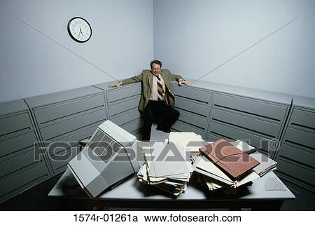 High angle view of a businessman standing in the corner of a room View Large Photo Image Stock Image - High angle view of a businessman standing in the corner of a room. Fotosearch
